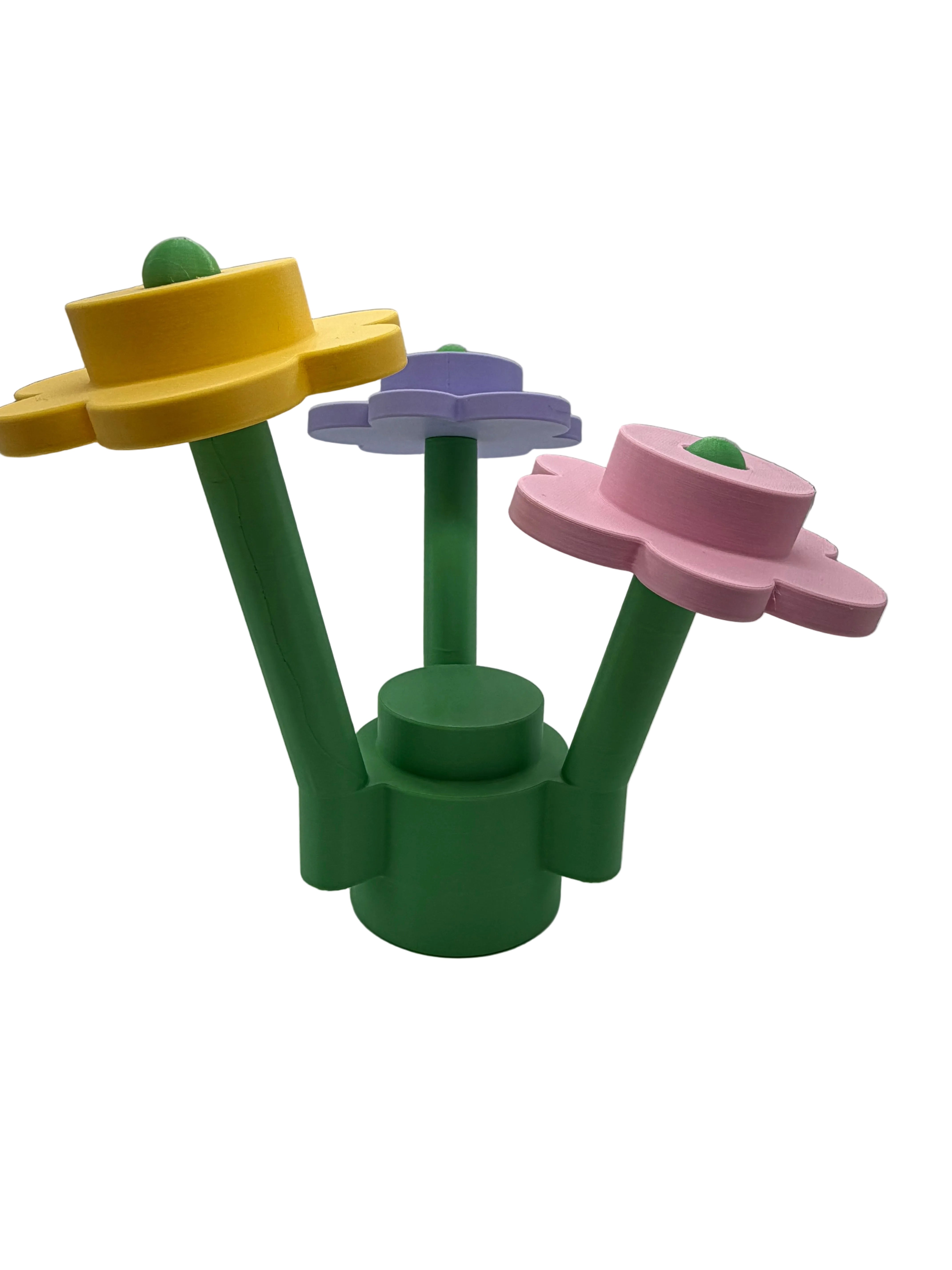 Side view of large brick-built flower display model highlighting stem structure and dimensional 3D printed design