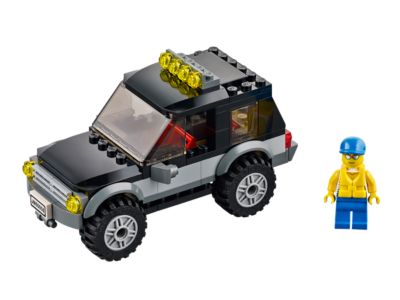LEGO model of a car with a figure on a white background