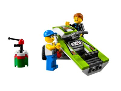 LEGO set with two characters and a green car on a white background