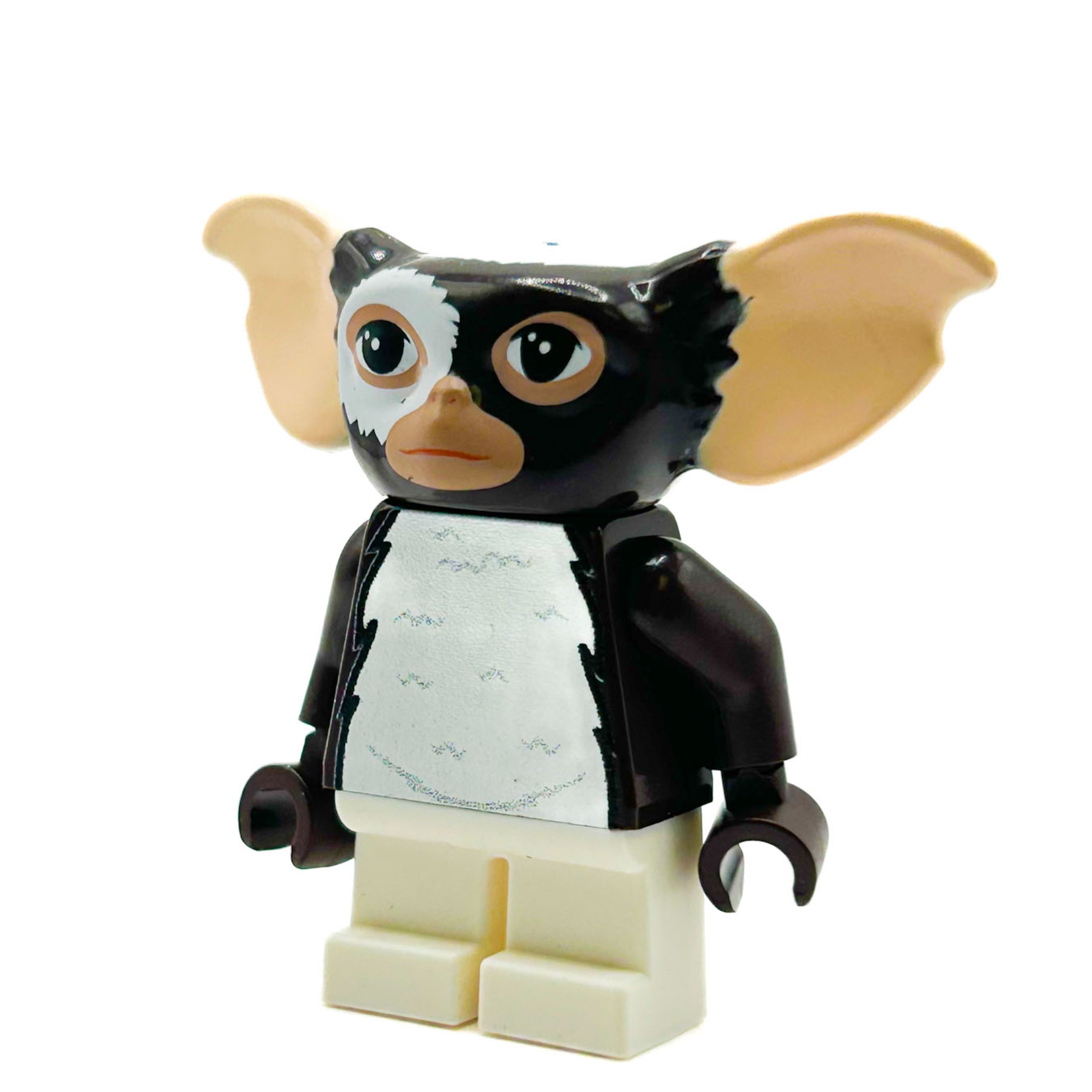 LEGO minifigure with large ears and a black jacket on a white background