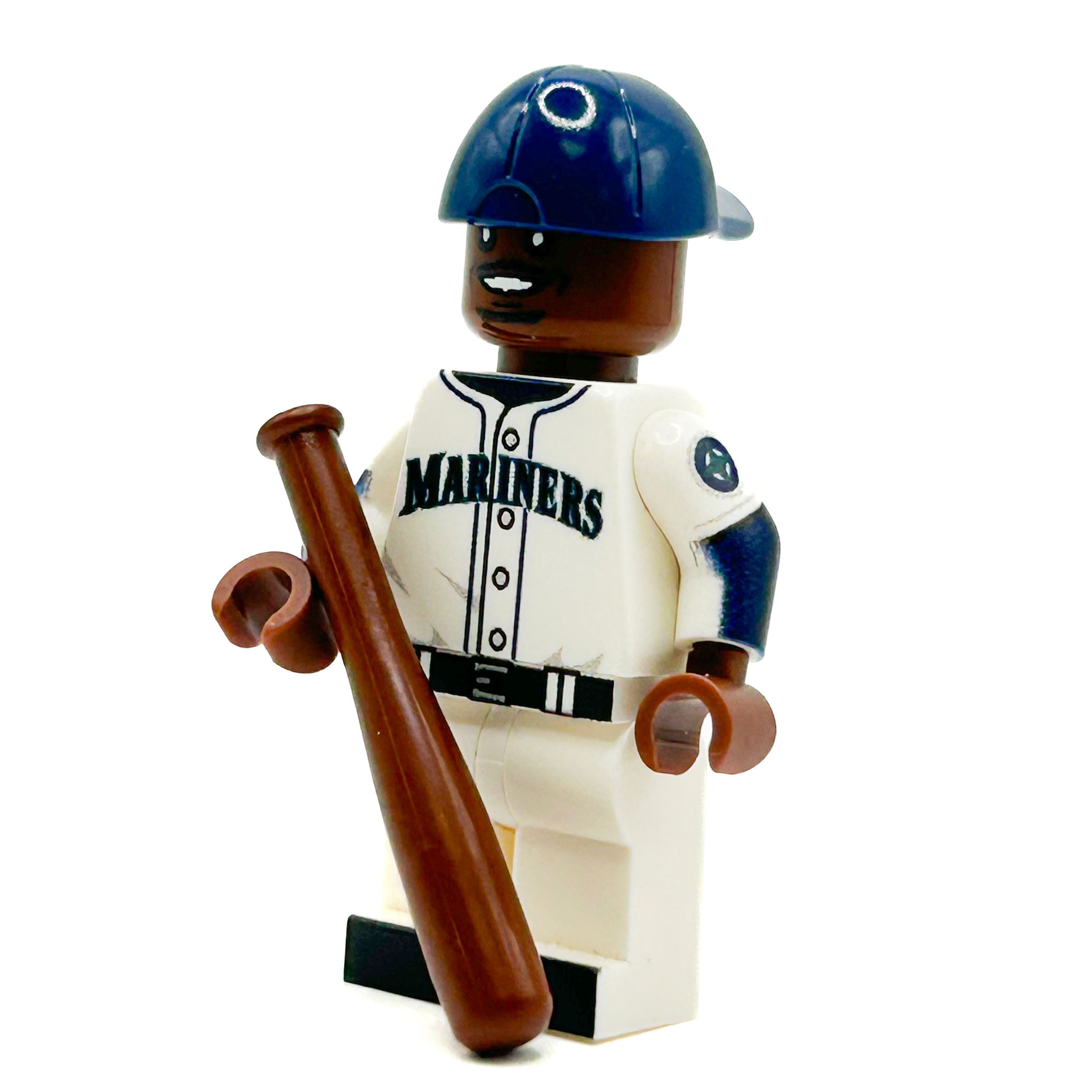 Baseball player figure with 'Mariners' uniform holding a bat on a white background