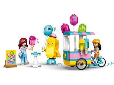 A colorful toy set showing a pink and yellow ice cream cart with balloons, a yellow robot figure, a woman figure holding a popsicle, and a child figure riding a blue bicycle, all on a plain white background.