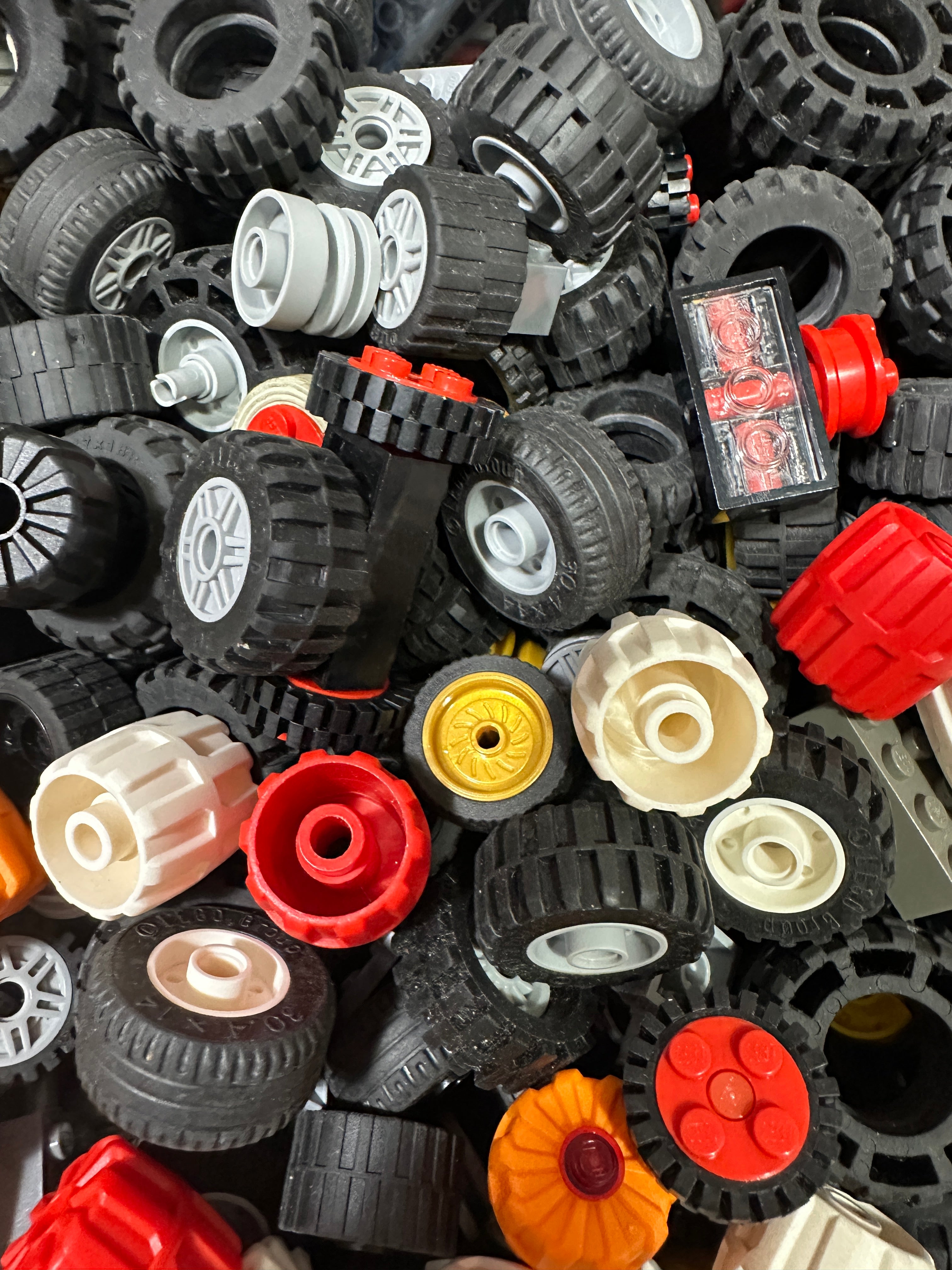 Bulk 1lb lot of preowned LEGO medium wheels and tires assorted styles from BAM Good Bricks