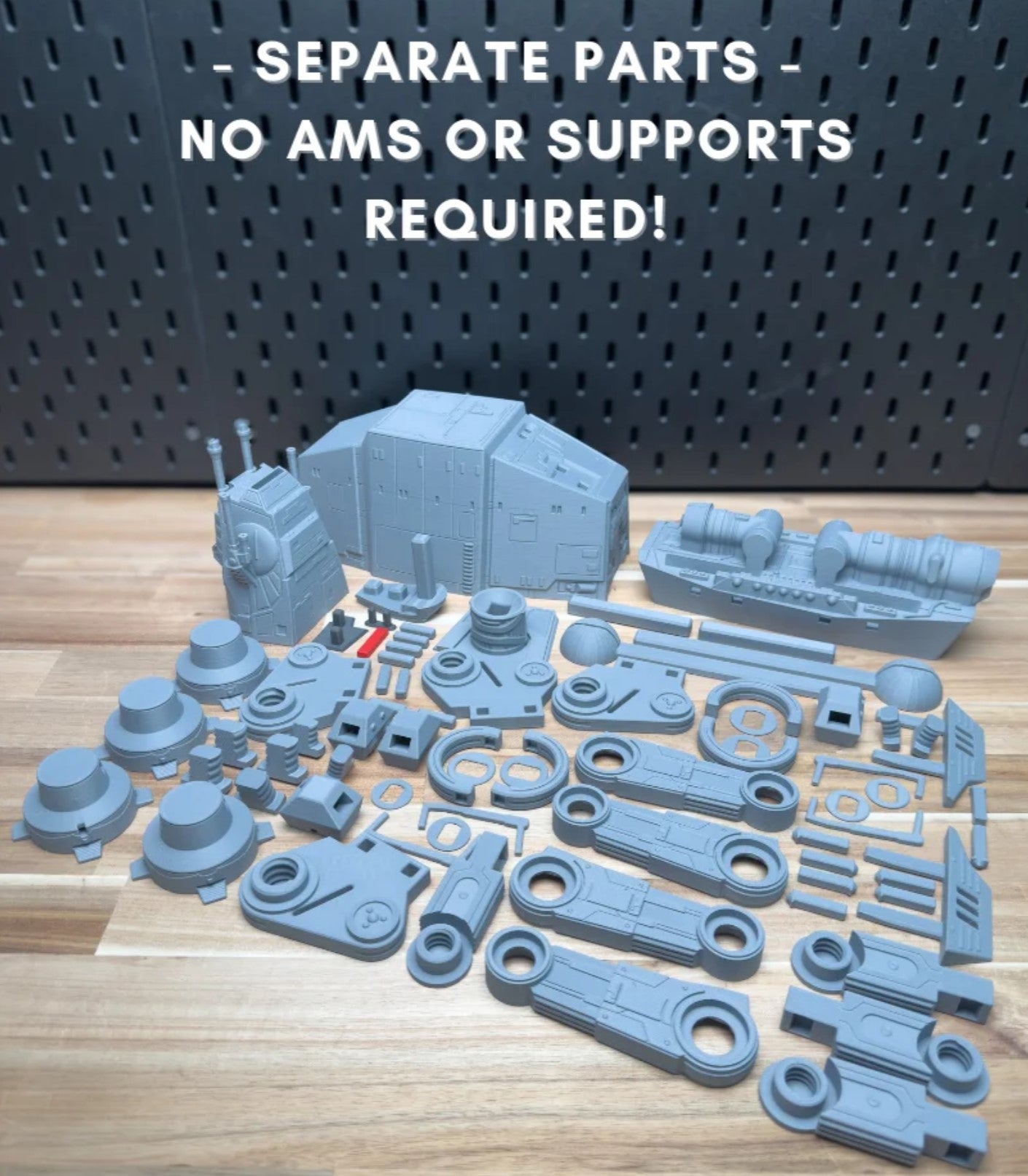 Blue model parts on a wooden surface with text indicating no additional materials or supports are required.